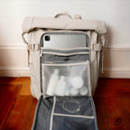 Lieblingstasche Lisbon Pro beige travel backpack with open back compartment, laptop sleeve, and organized toiletry bag.