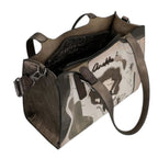 Lieblingstasche shoulder bag featuring a metallic bronze finish, artistic graphic print, and dual carry handles.