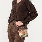 Lieblingstasche mini cross-body bag with floral pattern and brown trim worn by a woman in a brown sweater