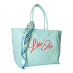 Lieblingstasche mint green canvas tote bag with coral embroidered logo and decorative paisley silk scarf