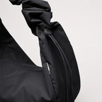 Lieblingstasche Moon Bag Ruffle Large in black made from sustainable recycled fishing nets with a gathered strap