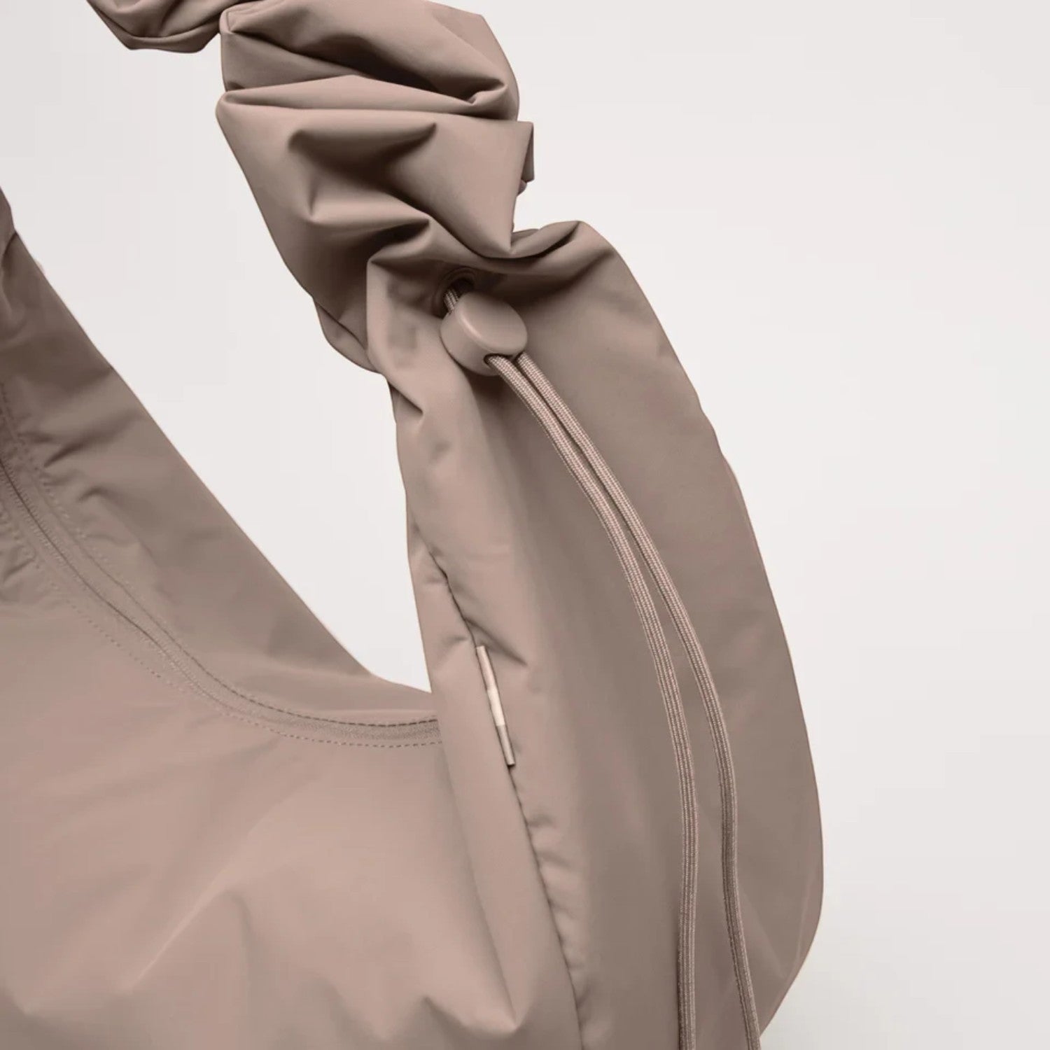 Lieblingstasche Moon Bag Ruffle Large in taupe made from recycled fishing nets with a gathered shoulder strap