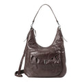 Lieblingstasche Mrs. Banoffee Pie dark brown leather hobo bag with a slouchy silhouette and front pocket detail.