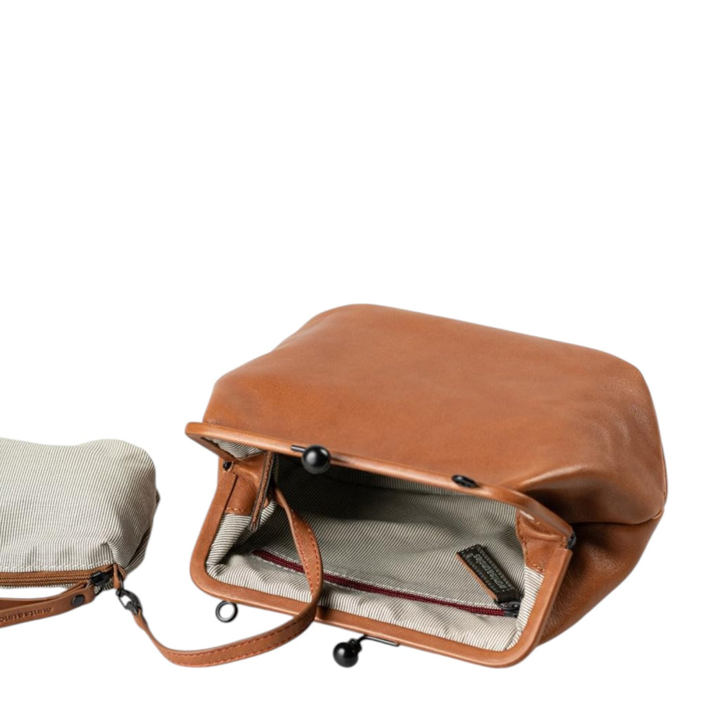 Lieblingstasche Mrs. Pizzelle brown leather handbag with a vintage-style kiss-lock clasp and striped interior lining.