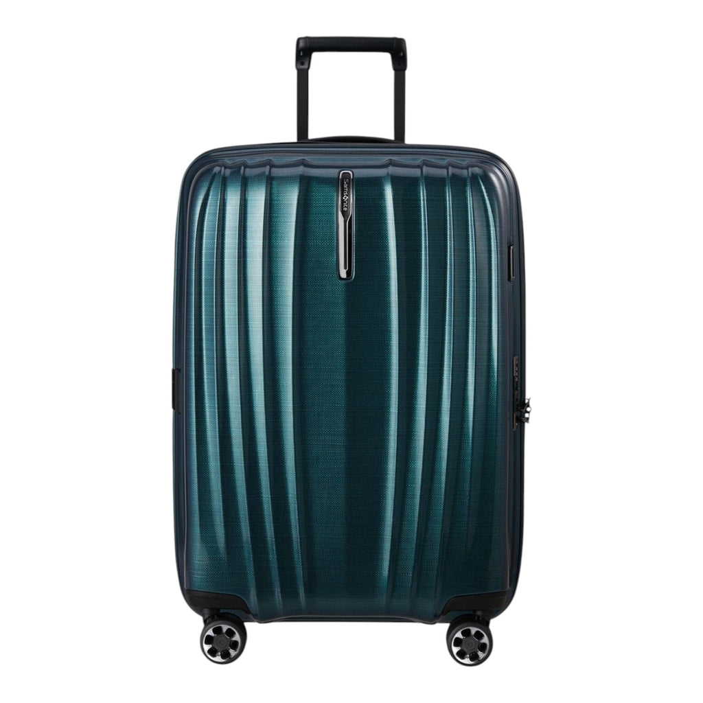 Lieblingstasche NEXIS Spinner 76/28 Exp suitcase in dark teal with a ribbed hard shell and four spinner wheels.