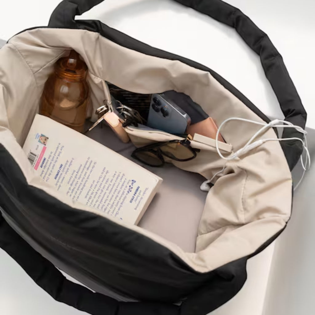 Lieblingstasche Norva 2in1 reversible shopper bag in black and beige with organized interior and padded handles