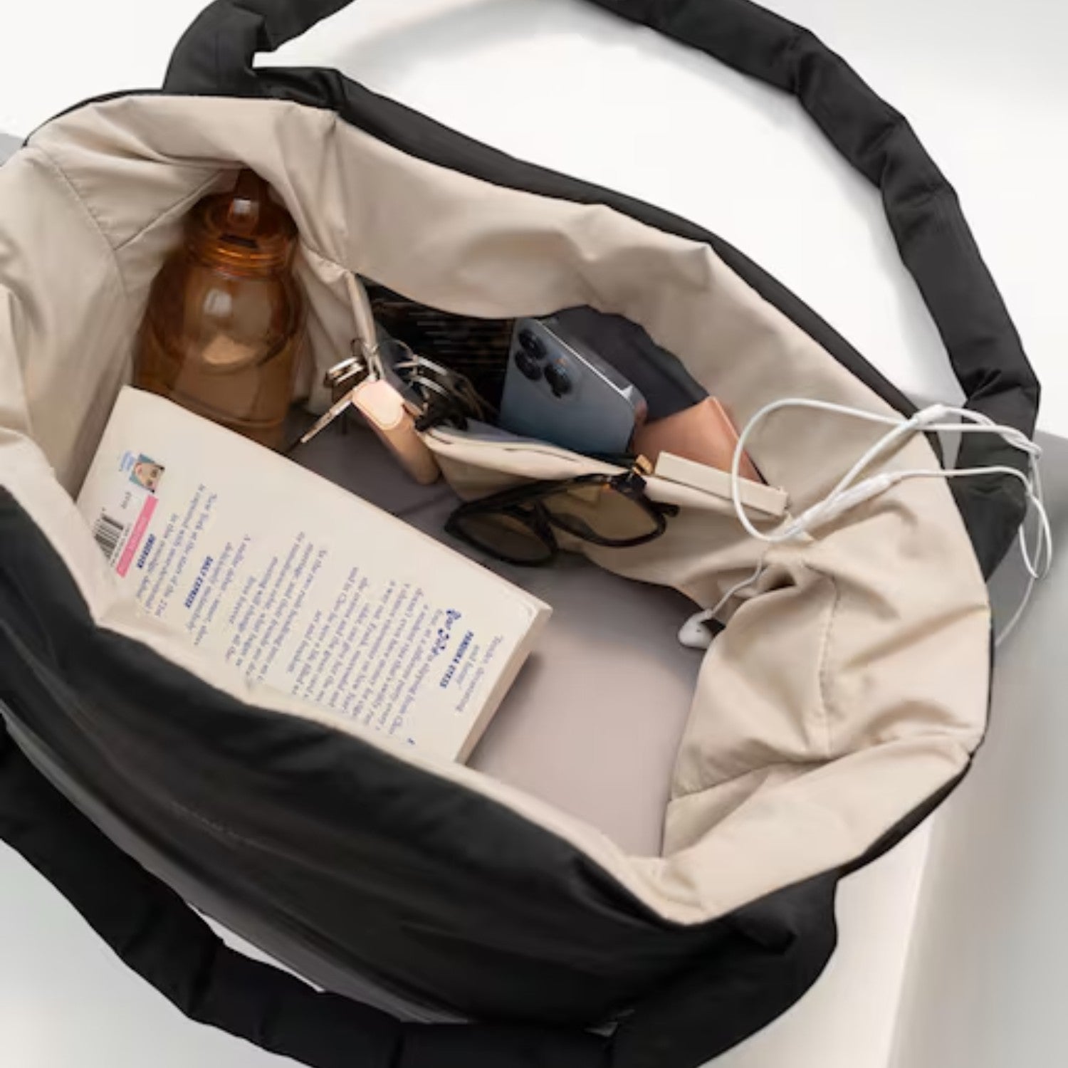Lieblingstasche Norva 2in1 reversible shopper bag in black and beige with organized interior and padded handles