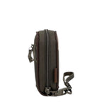 Lieblingstasche olive green compact wallet with a sturdy zip closure and a detachable wrist strap, side view.
