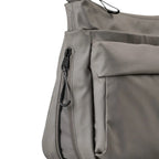 Lieblingstasche Omono RE lite grey crossbody bag featuring a side zipper pocket and durable synthetic fabric.