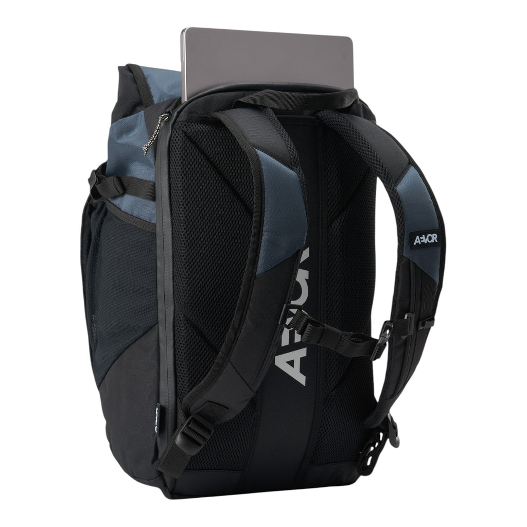 Lieblingstasche Roll Pack 2.0 backpack in black and blue with a laptop stored in the rear compartment