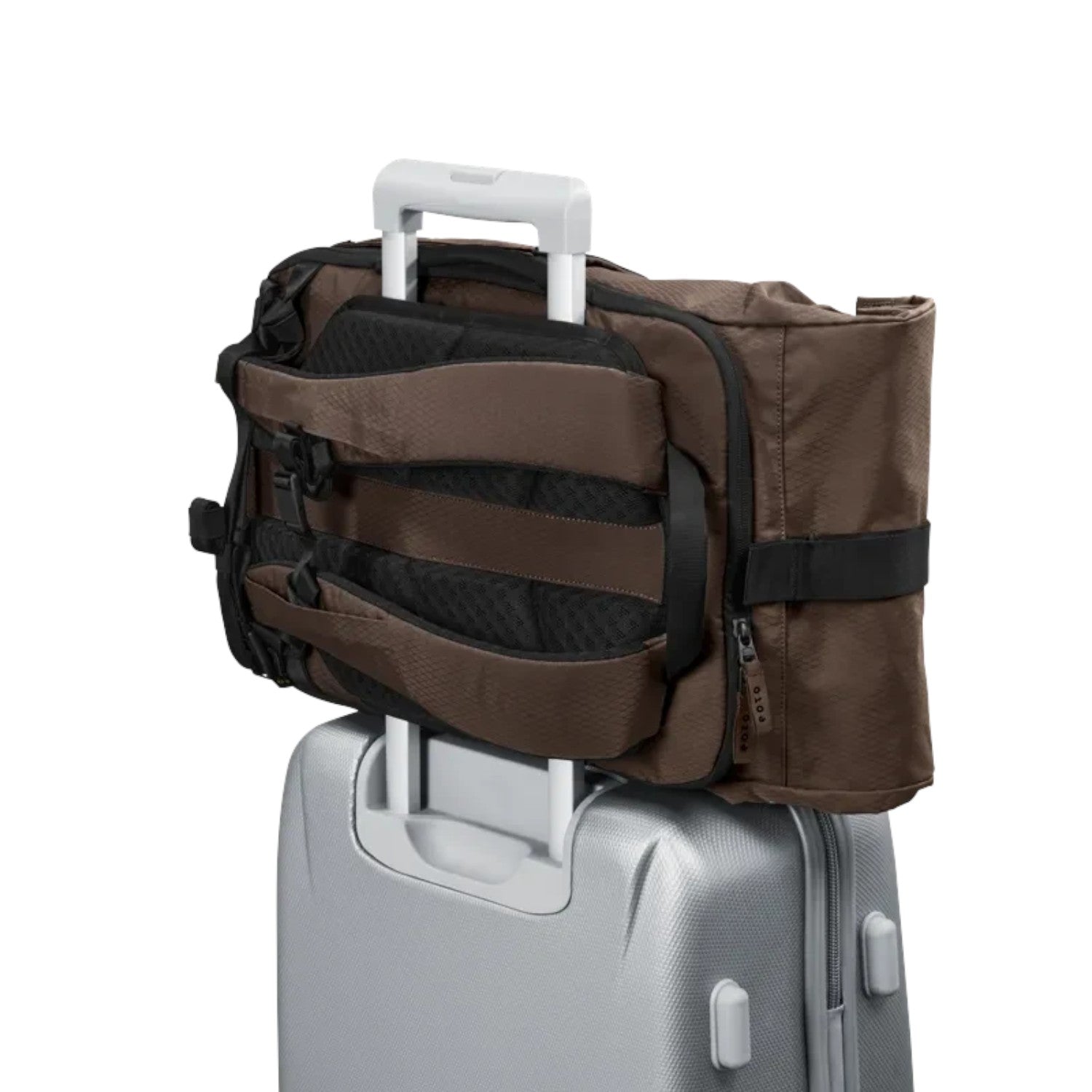 Lieblingstasche Rolly32 brown rolltop backpack attached to a silver suitcase trolley handle for travel