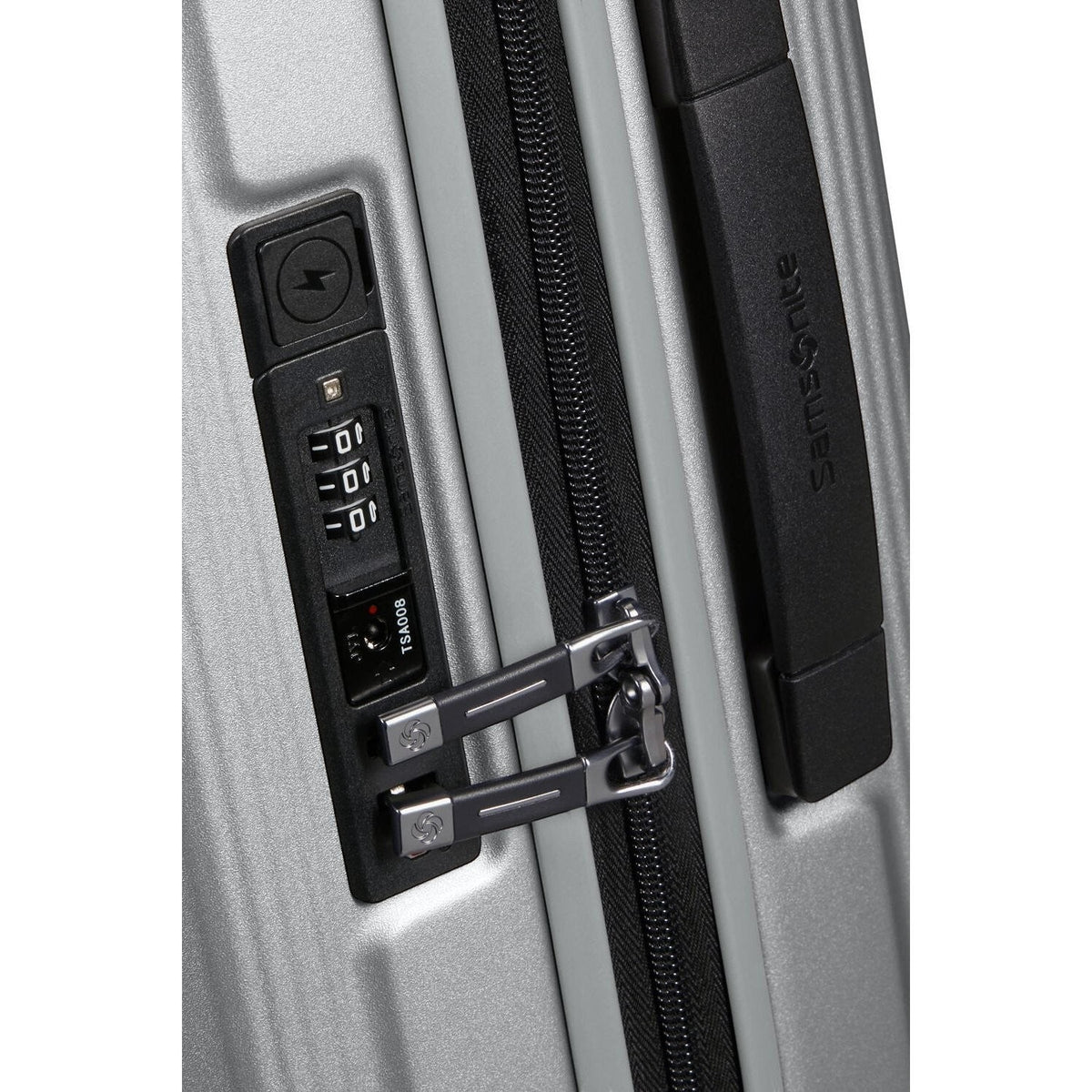 Lieblingstasche Samsonite NUON spinner suitcase featuring a silver hardshell, black zipper, and integrated TSA lock.
