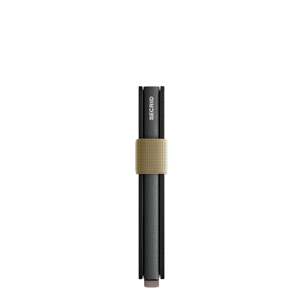 Lieblingstasche Secrid Bandwallet Matte in black with a beige elastic band for secure card storage