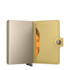 Lieblingstasche Secrid Miniwallet Pebble in metallic gold leather with an integrated RFID-protected card holder.