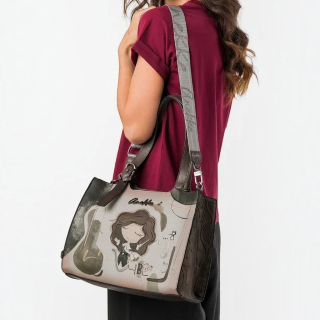 Lieblingstasche shoulder bag with whimsical cartoon illustration, brown accents, and a grey branded shoulder strap
