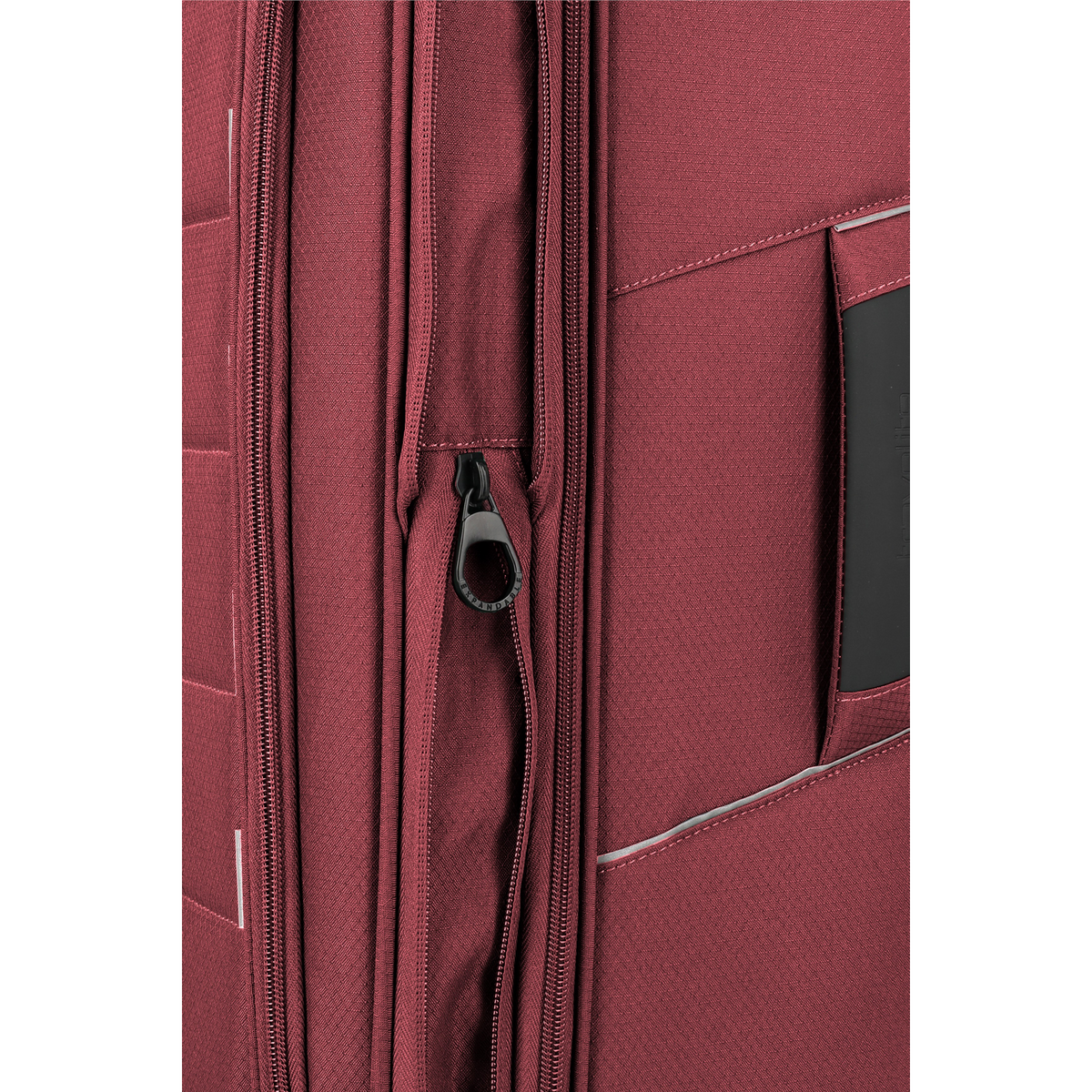 Close-up of the Lieblingstasche Skaii trolley suitcase in burgundy red featuring an expandable zipper detail.
