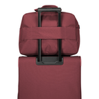 Lieblingstasche Skaii Weekender travel bag in burgundy, featuring a trolley sleeve attached to a matching suitcase.
