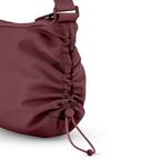 Lieblingstasche Skara Small burgundy nylon shoulder bag with a drawstring side detail and adjustable strap