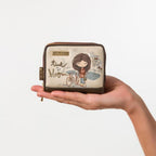 Lieblingstasche small beige wallet with whimsical girl illustration and time to bloom text held in a hand