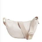 Lieblingstasche small moon bag in light beige nylon with adjustable strap.