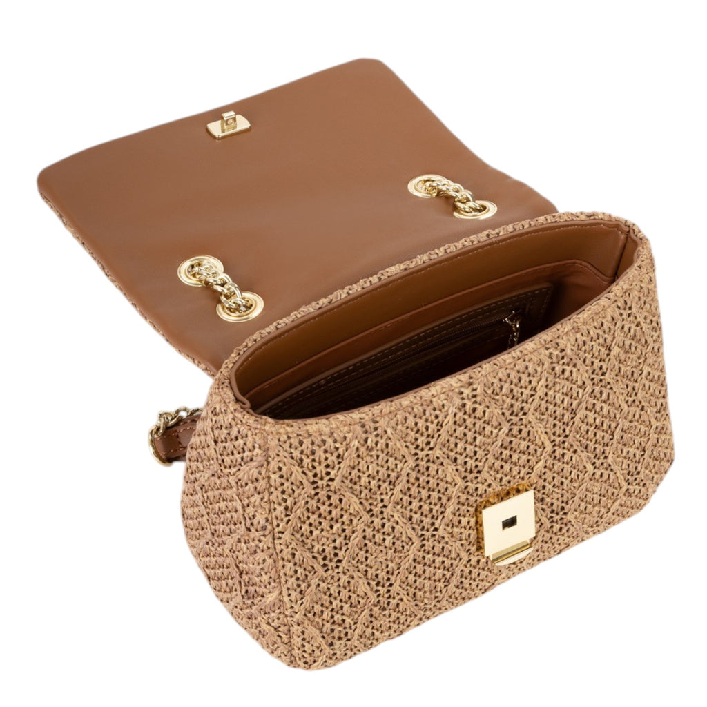 Lieblingstasche Ocarina flap bag in woven straw with brown leather interior and gold hardware.
