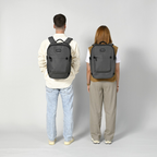 Lieblingstasche Tidy22 grey business laptop backpack worn by a man and woman against a neutral background