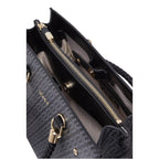 Lieblingstasche Tote M handbag interior with black patterned synthetic leather, gold zipper, and braided handles.