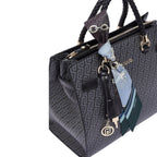 Lieblingstasche Tote M handbag in black with a patterned logo print, braided handles, and a decorative silk scarf.