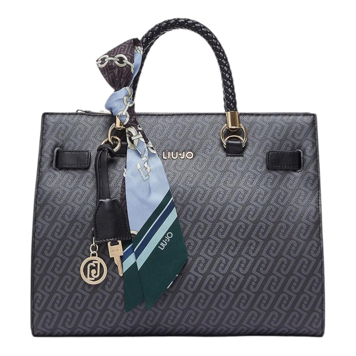 Lieblingstasche Tote M handbag in black with a monogram pattern, braided handles, and a decorative silk scarf charm.