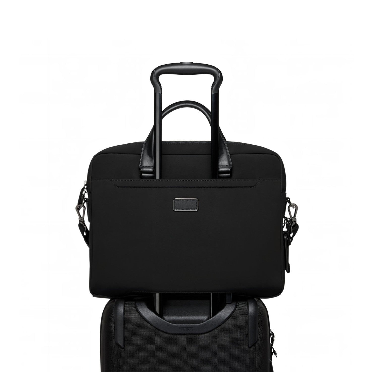 Lieblingstasche Tumi Harrison Avondale black nylon top zip briefcase mounted on a rolling suitcase handle