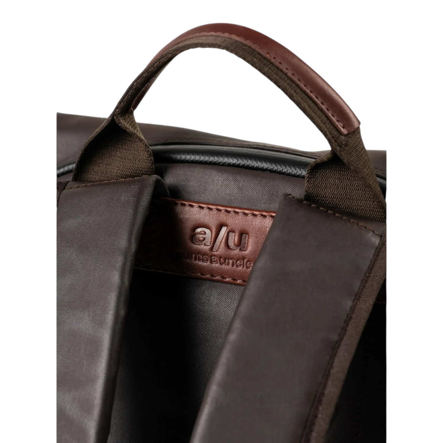 Lieblingstasche Wakayama backpack featuring brown nylon fabric, leather handle, and embossed a/u logo detail