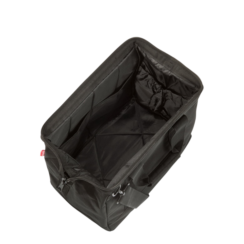 Lieblingstasche Allrounder M travel bag in black polyester with an open top, internal pockets, and metal frame.